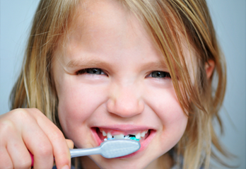 Child brushing teeth